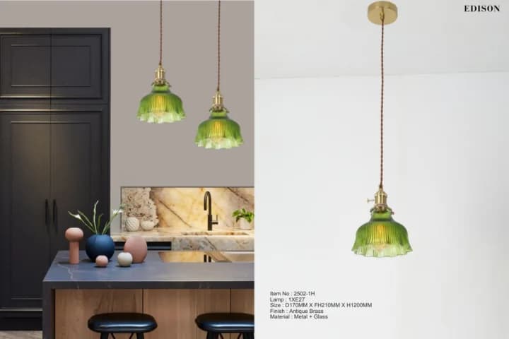 Green glass pendants over a kitchen island