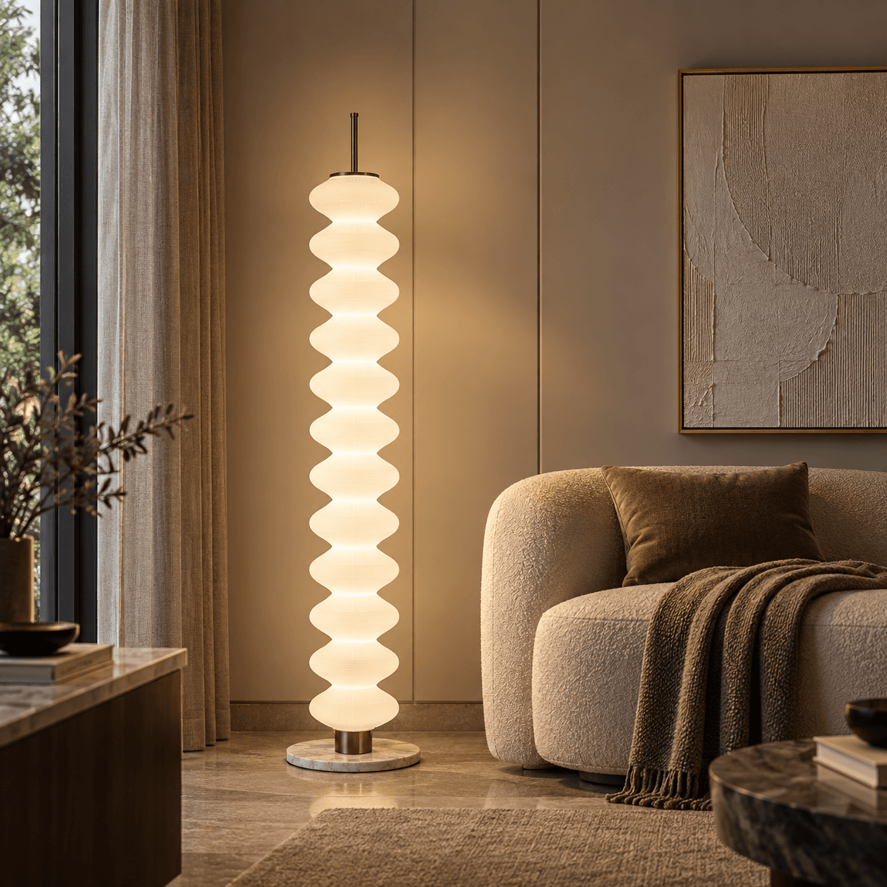 A floor lamp with a fabric shade beside an armchair, from the floor and table catalogue
