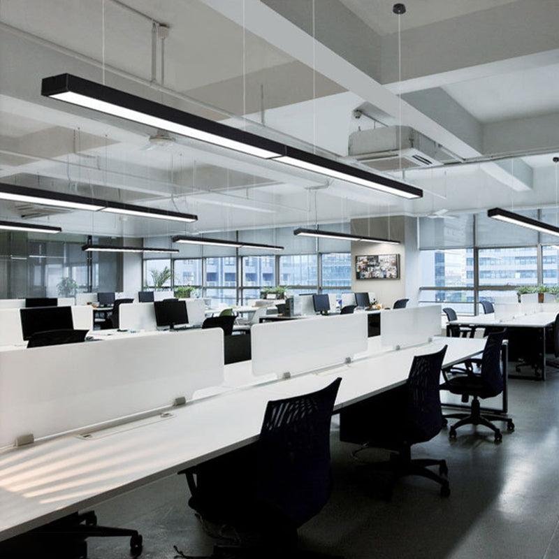 Modern office with suspended LED linear lighting for commercial workspaces by Edison Lighting.